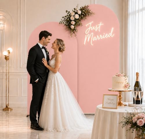 metal arch backdrop stand and pink cover set on a desk or shelf