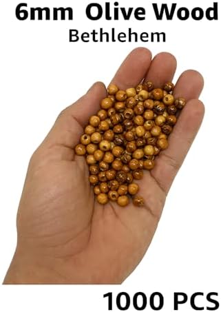 holy land olivewood 6mm rosary beads for sale shown in use