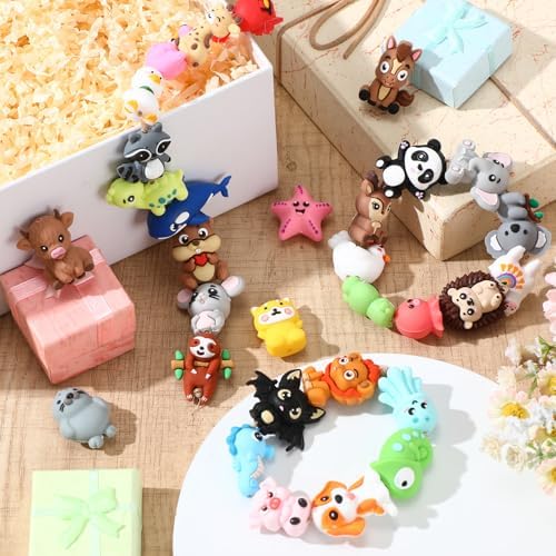 watersay 70 pcs animals 3d silicone focal beads on a desk or shelf