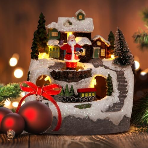christmas collectibles building village house musical snow globe on a desk or shelf