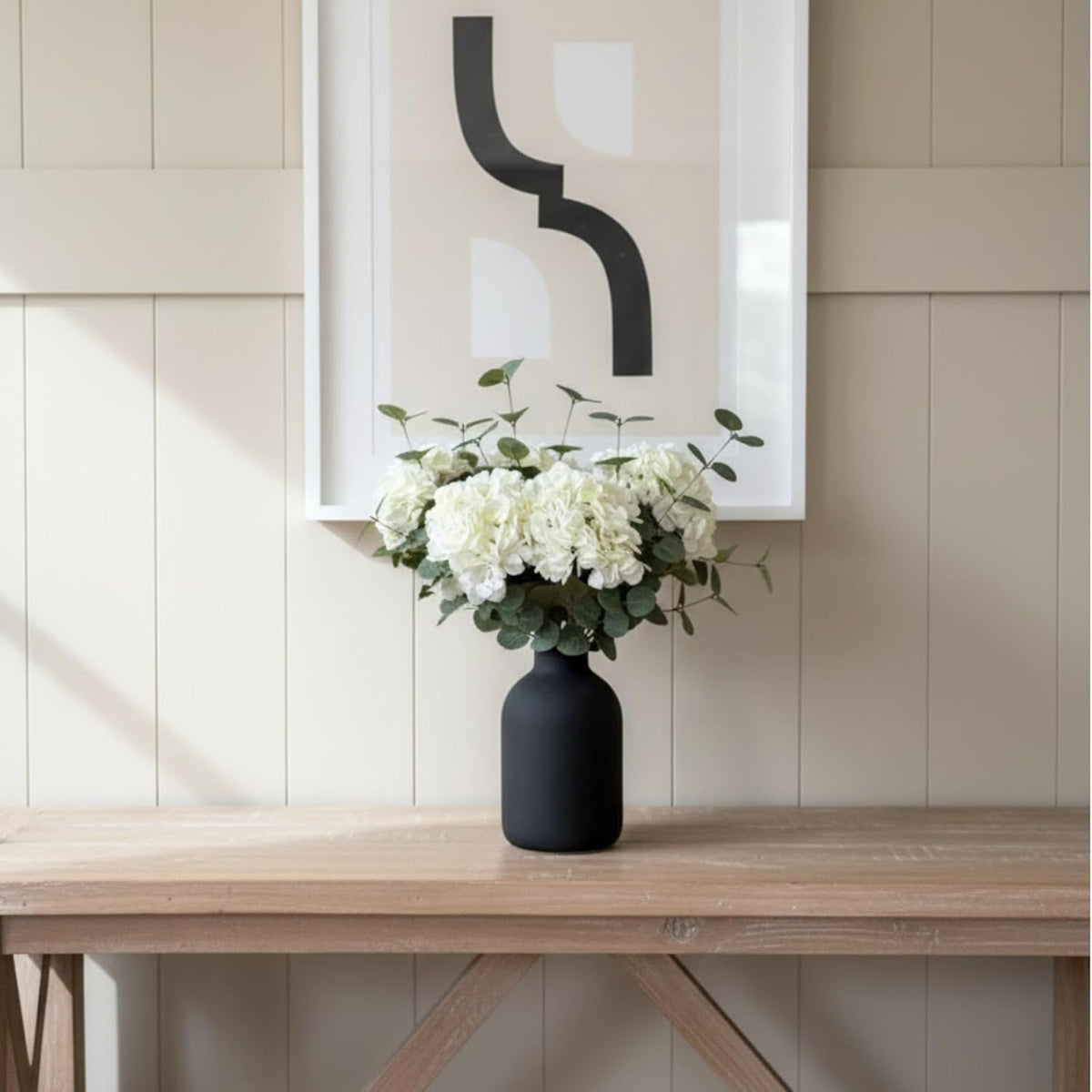 real touch white faux hydrangea and eucalyptus, floral on a desk or shelf