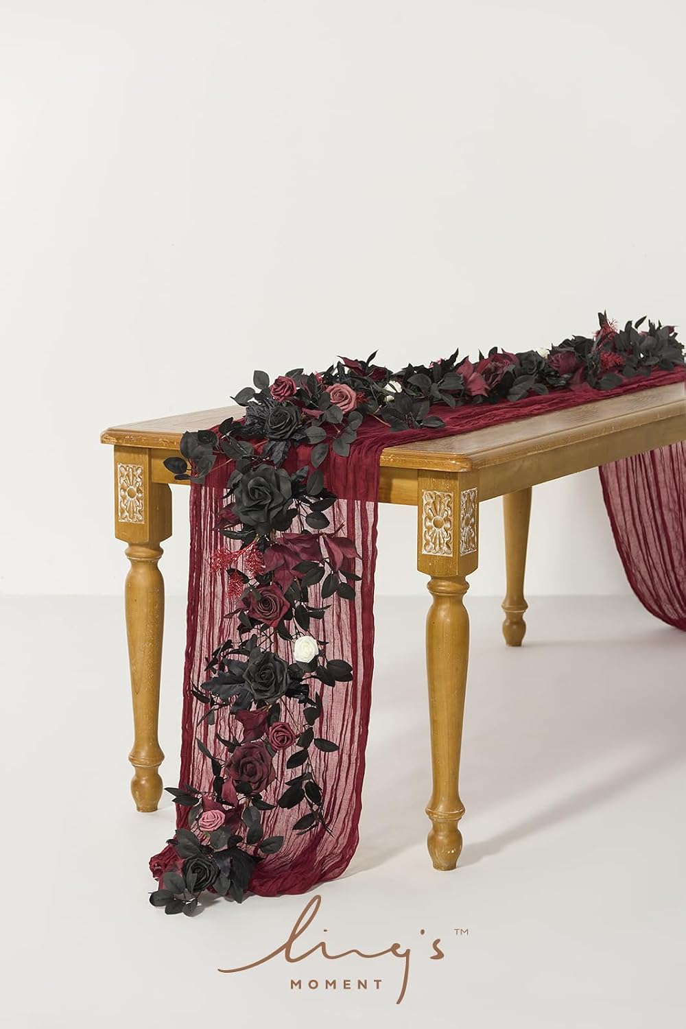 ling's moment 5 ft black artificial flower garland shown in use