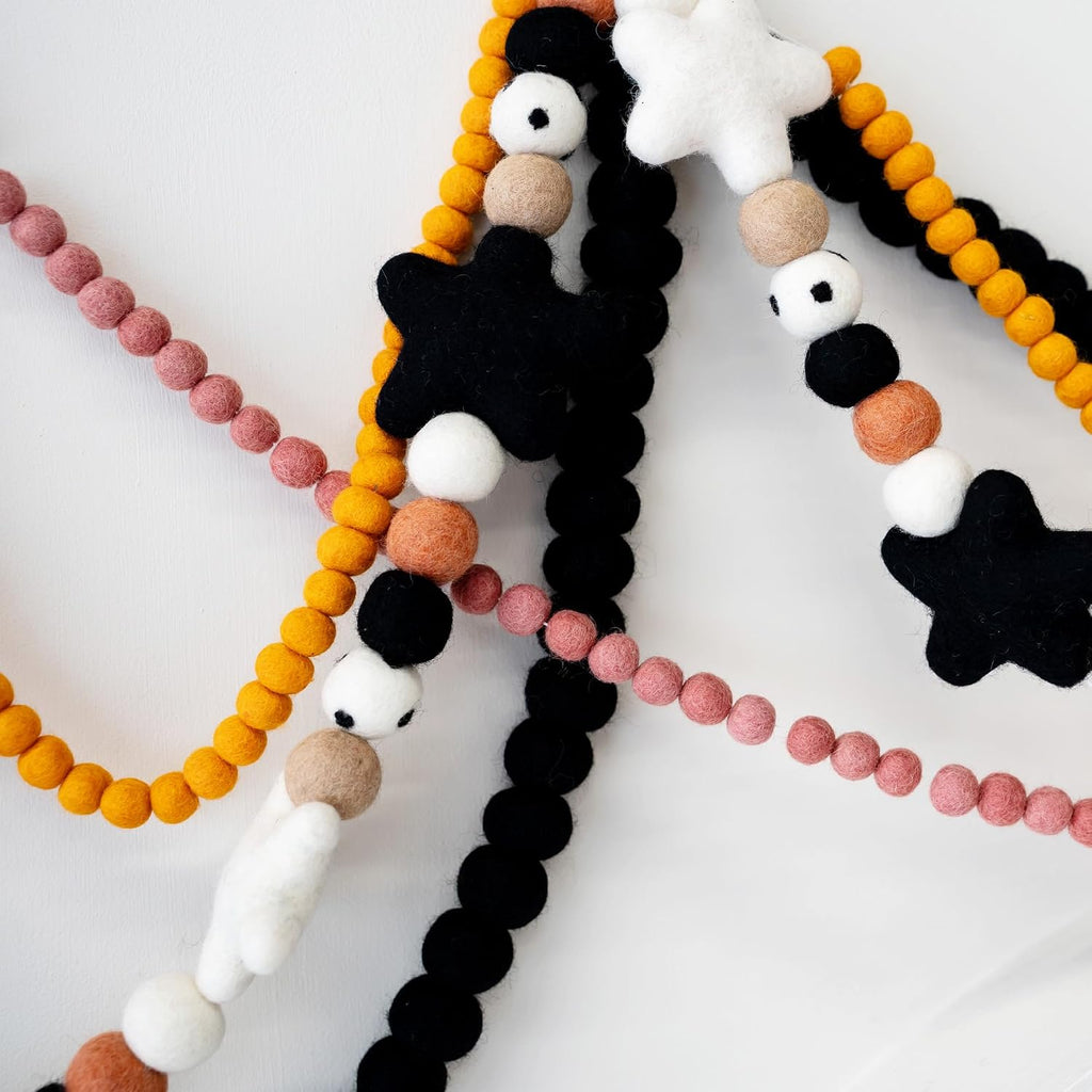 black felt ball garland, wool pom pom garland shown in use