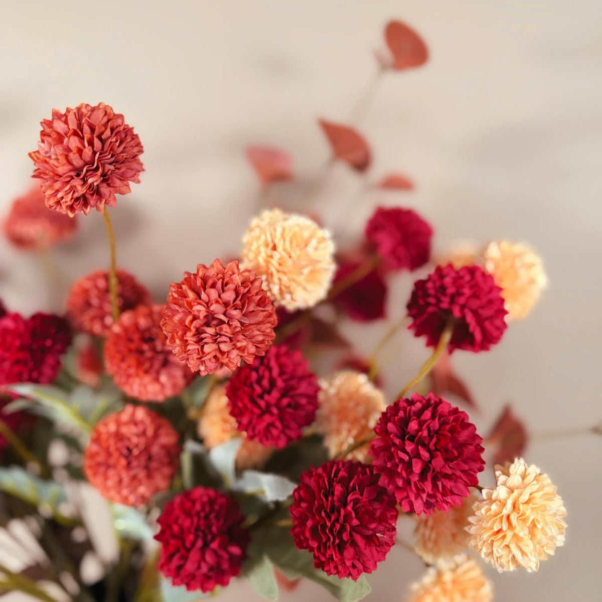 faux fall flowers, burnt orange artificial floral stems, side view