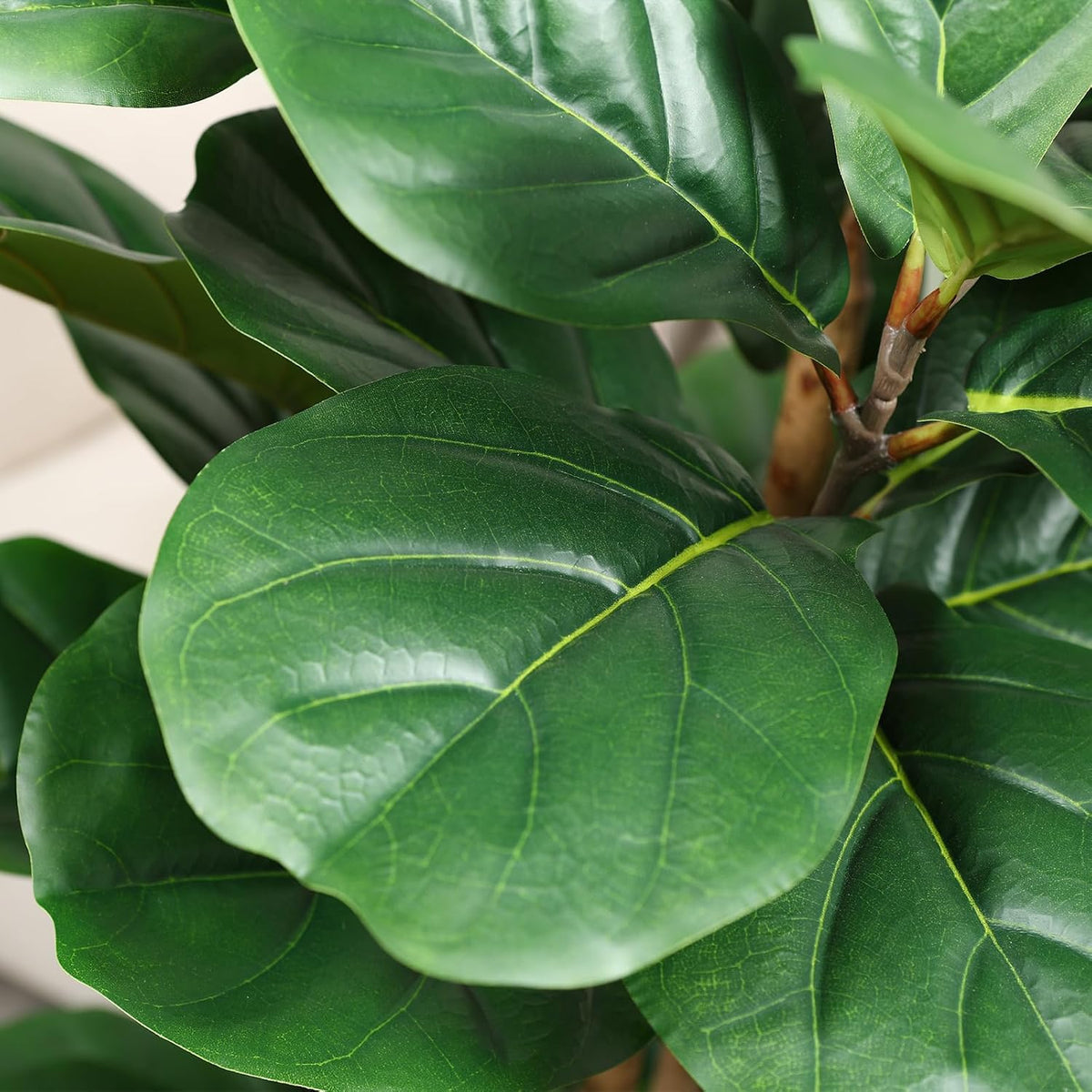 artificial fiddle leaf fig tree with white planter, side view