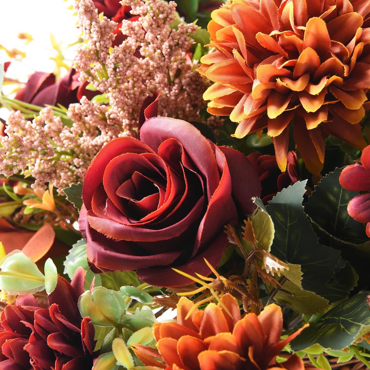 fall artificial faux flowers in vase fake silk, close-up detail