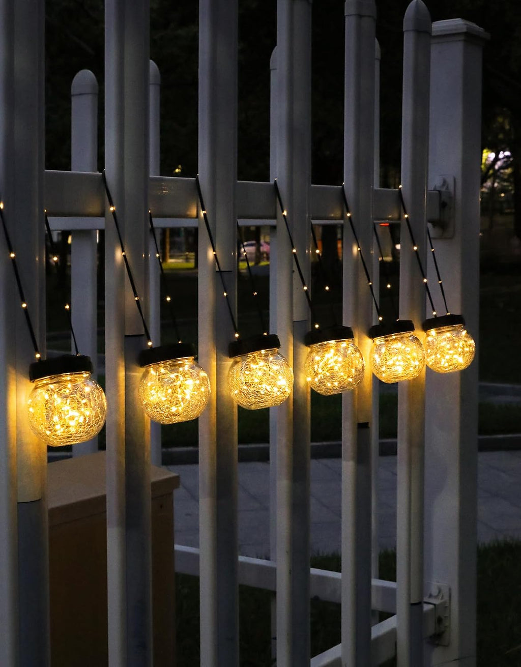 partphoner solar lights outdoor waterproof 12-pack, solar powered shown in use
