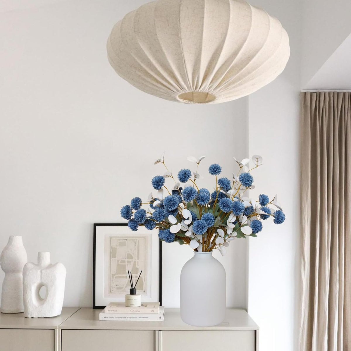 faux dusty blue flowers, 12 blue and white on a desk or shelf