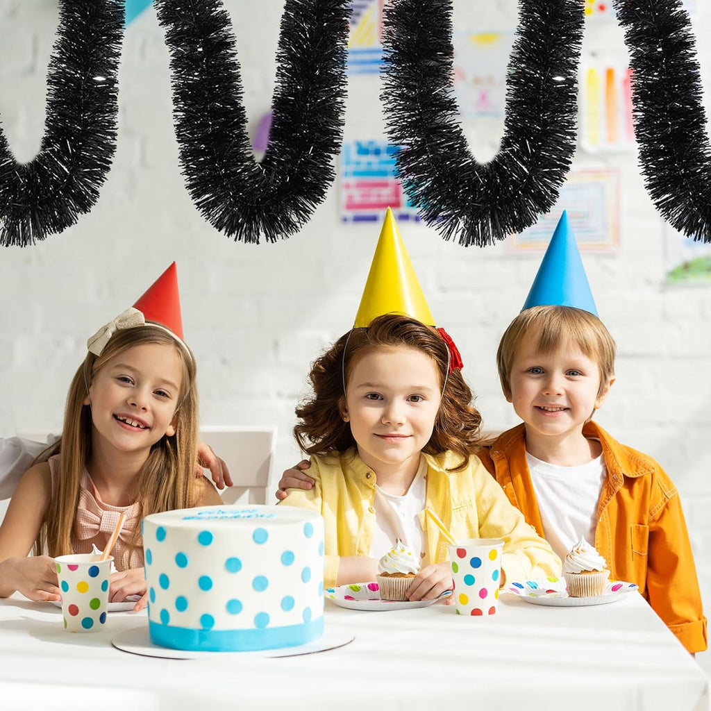 150 ft black tinsel garland - holiday tinsel on a desk or shelf