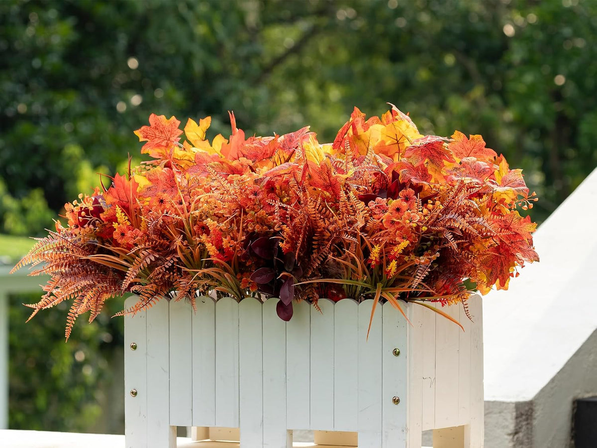 artificial fall flowers outdoors, faux maples & mums, front angle view