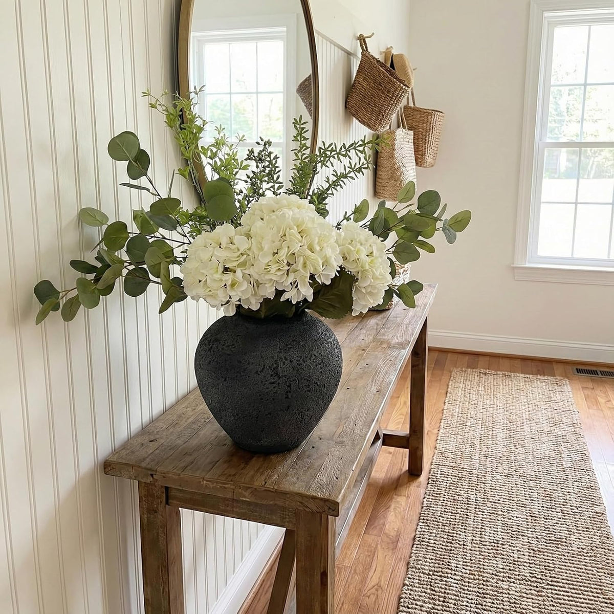 faux arrangement - eucalyptus & white hydrangea flowers on a desk or shelf
