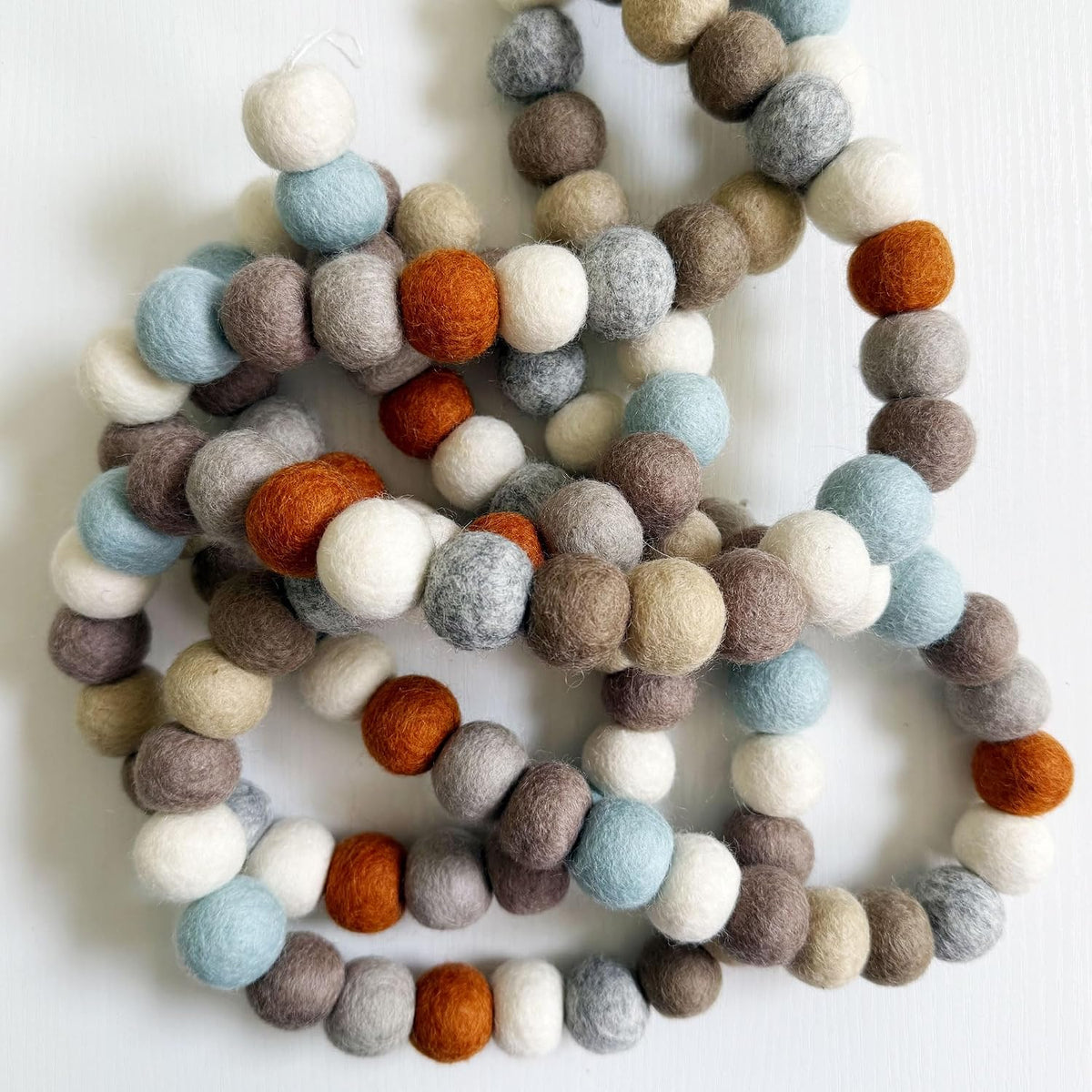 large natural felt ball garland, pom pom decor, side view
