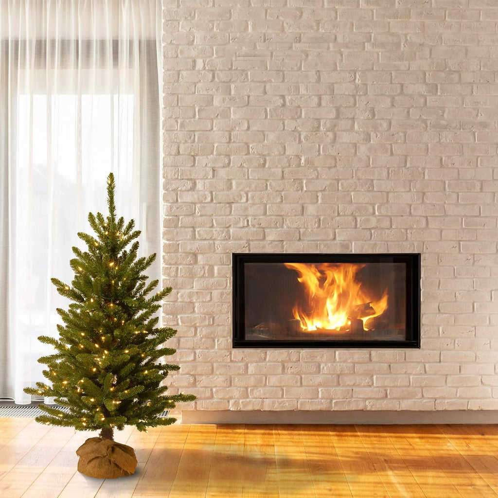 national tree company 4ft pre-lit kensington mini artificial shown in use