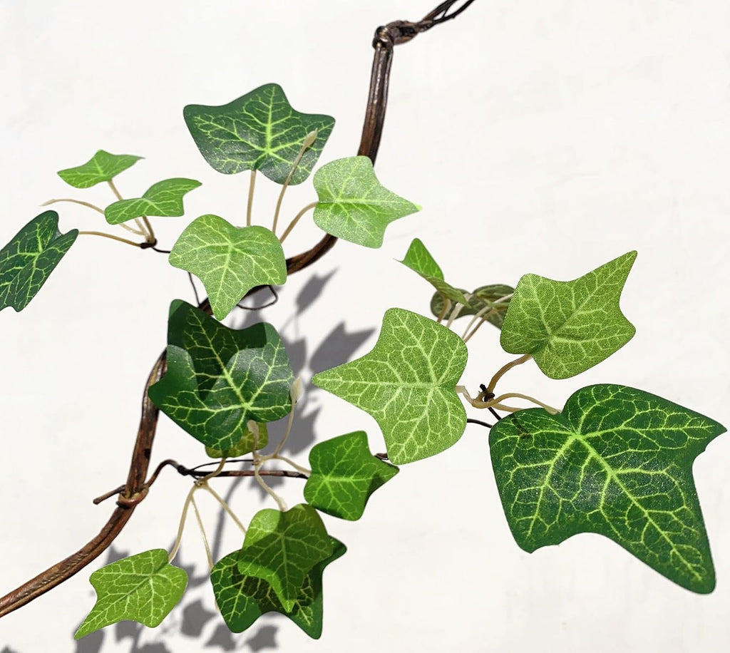 artificial rattan tree vines with creeper leaves climbing on a desk or shelf