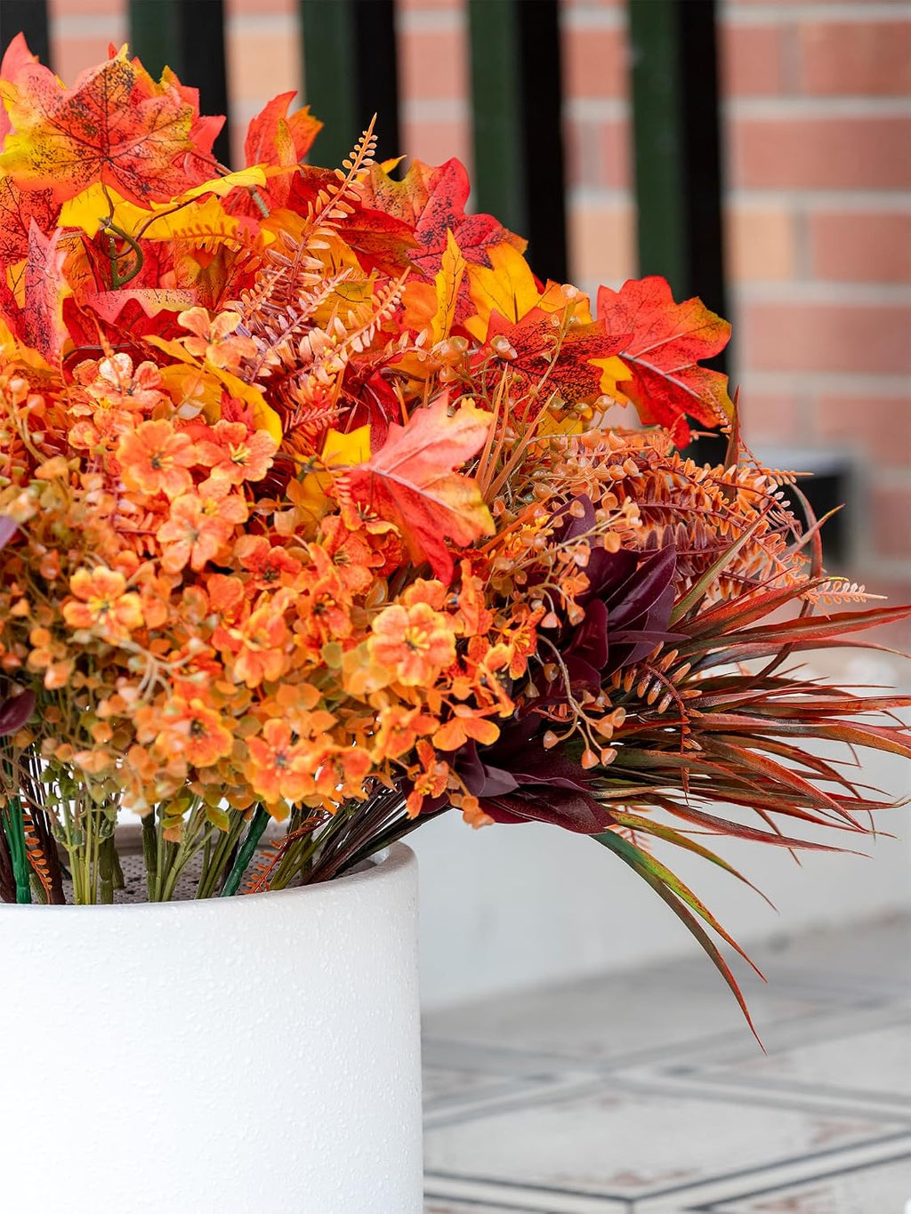 artificial fall flowers outdoors, faux maples & mums on a desk or shelf