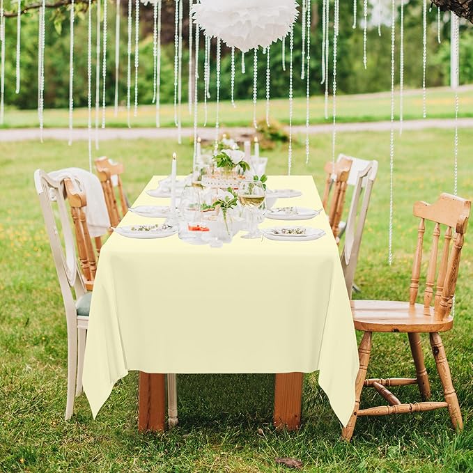 QZYL 12 PCS Ivory Plastic Tablecloths, 54 in x 108 in Dinner Table Cloths, Rectangle Table Cover for Birthday Party Family Gathering Wedding