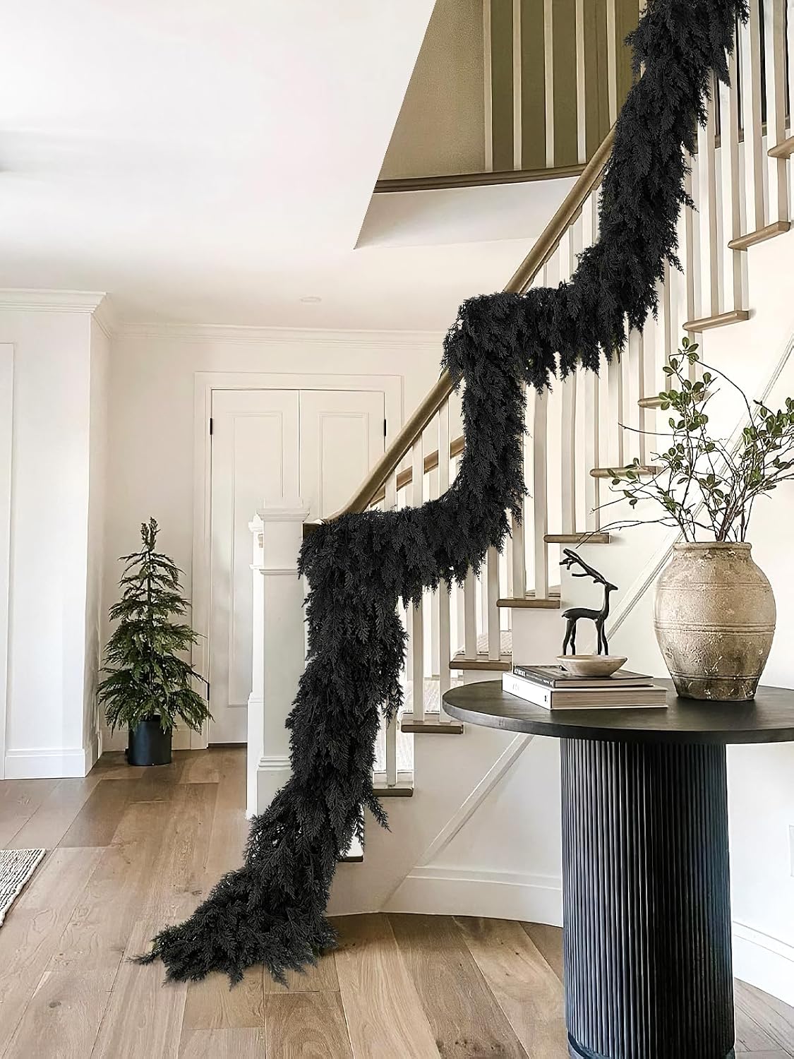 9 ft halloween cedar garland, black real touch on a desk or shelf