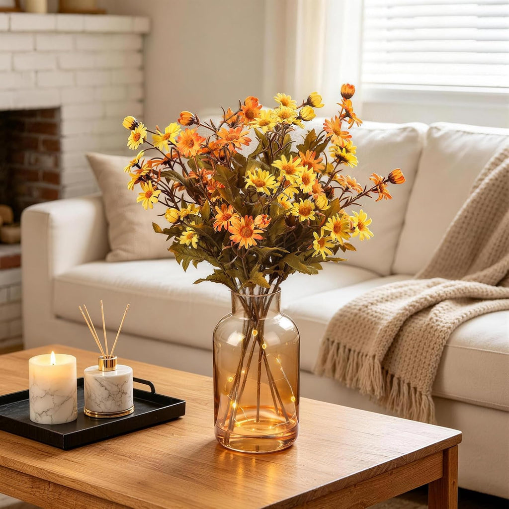 artificial daisy flowers fall flowers in amber glass shown in use