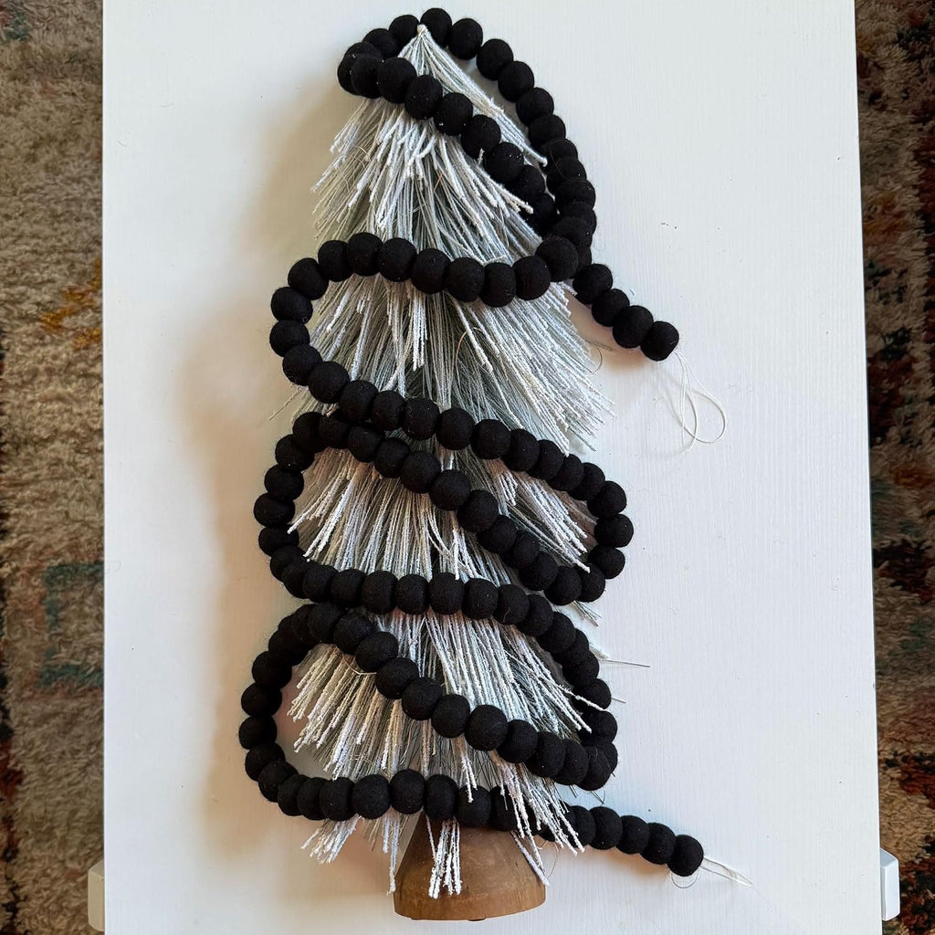 black felt ball garland, wool pom pom garland, front angle view
