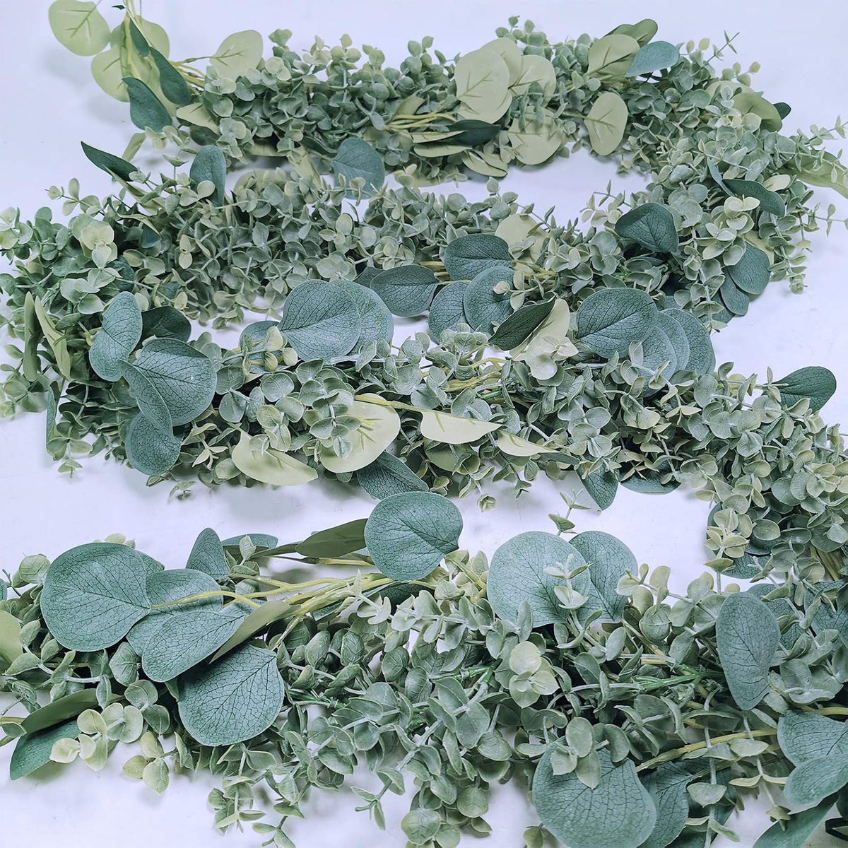 8.3' long faux eucalyptus greenery garland - silver shown in use