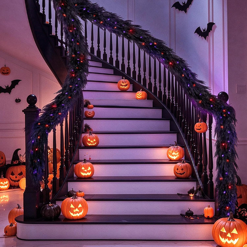 9ft soft touch black norfolk pine halloween garland on a desk or shelf