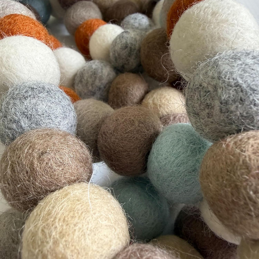large natural felt ball garland, pom pom decor, close-up detail