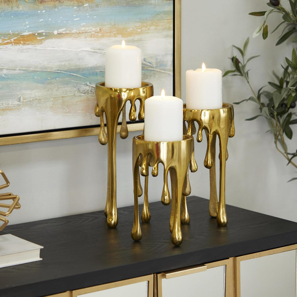 CosmoLiving by Cosmopolitan Aluminum Metal Abstract Decorative Candle Holder Melting Drip Candle Stand, Set of 3 Candlestick Holder 12", 10", 8"H, Gold