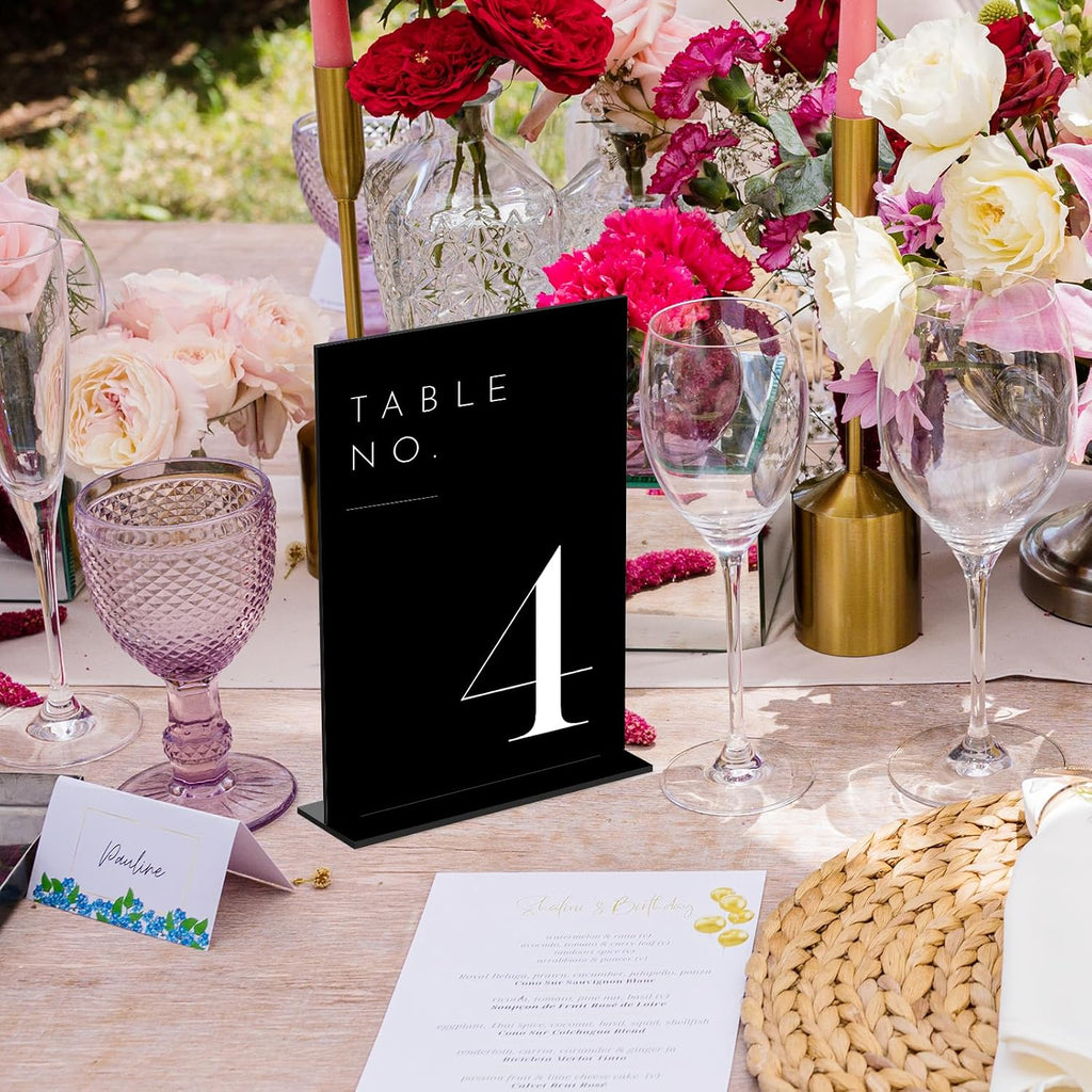 wedding black table numbers 1-30 with stands, 5"x7" on a desk or shelf