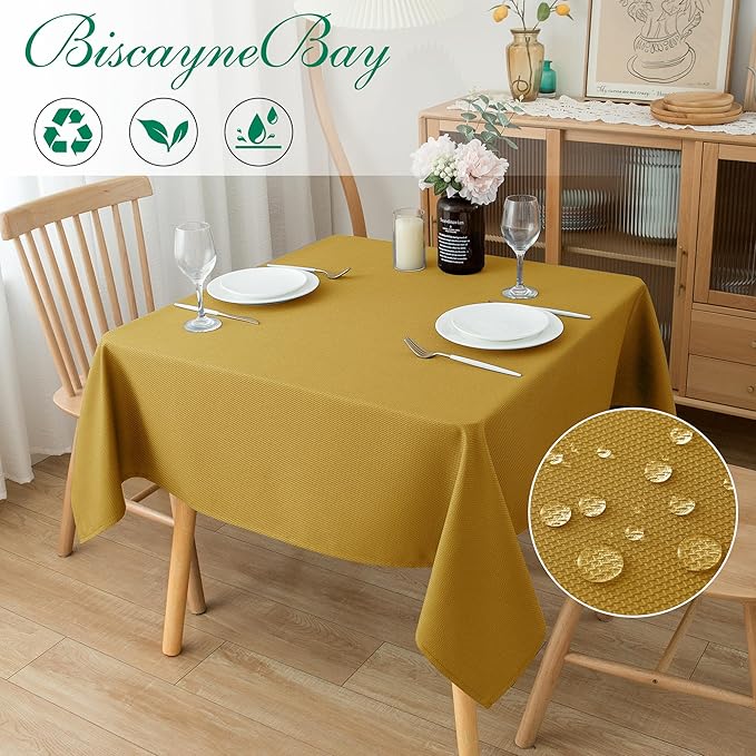 Biscaynebay Textured Fabric Christmas Square Table Cloth 70x70 Inches, Gold Water Resistant Tablecloths for Dining, Kitchen, Wedding and Parties etc. Machine Washable