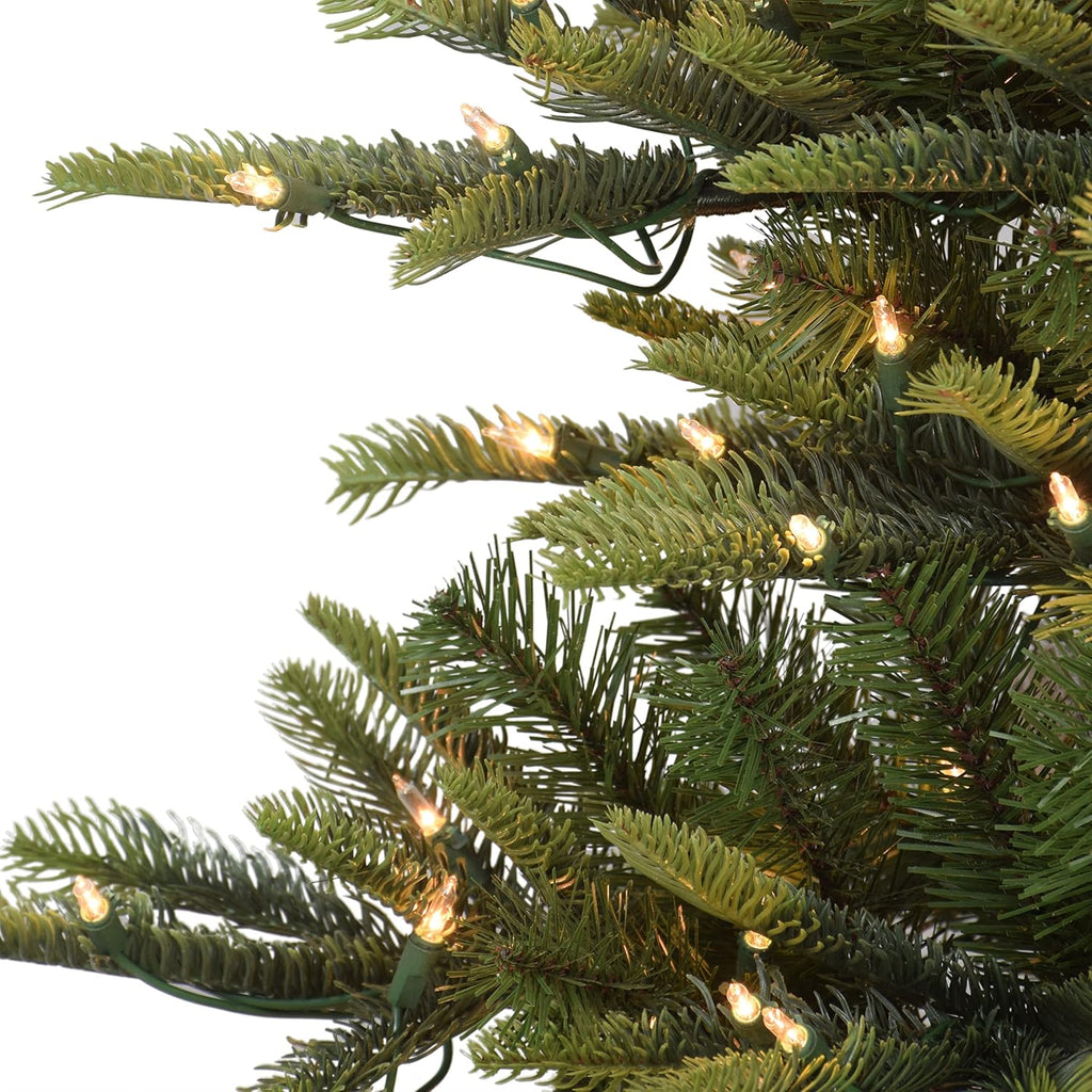 puleo international 7.5ft pre-lit slim aspen fir artificial shown in use